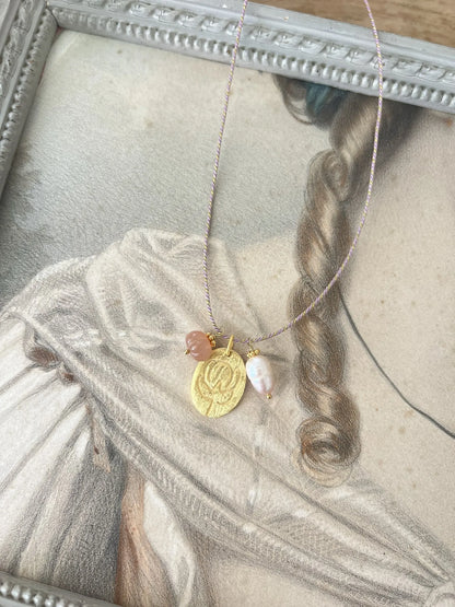 ojigi sautoir médaille perle de soleil